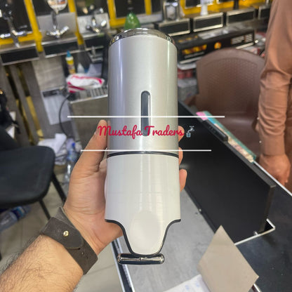 hand holding soap dispenser in shop